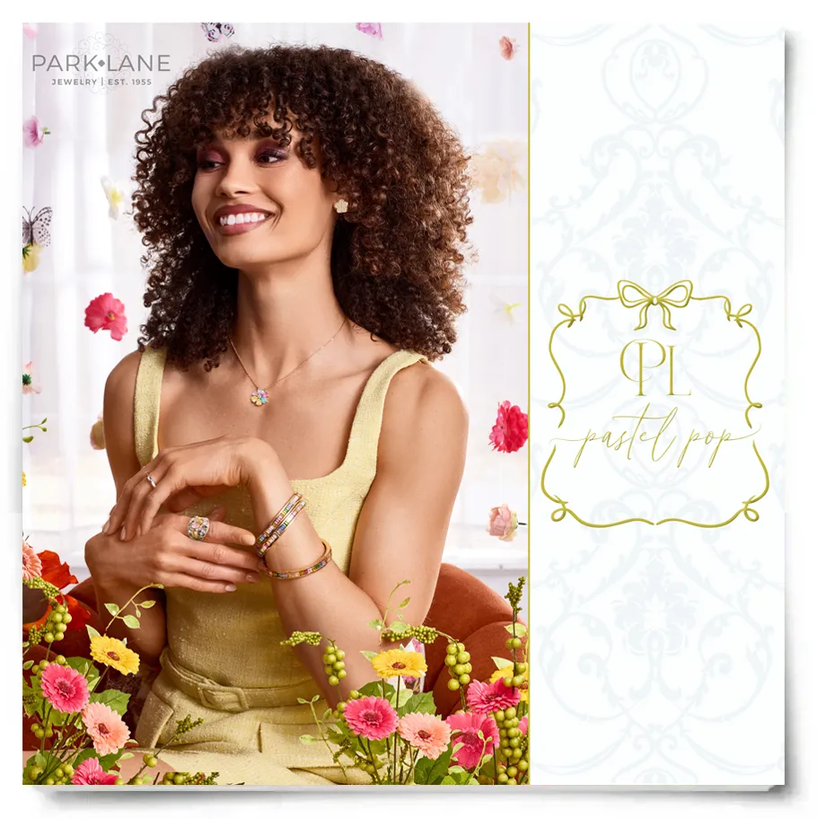 Model in light yellow dress, laughing and smiling in gold, gemmed jewelry